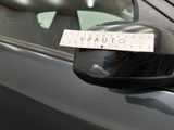 a sticker on the side view mirror of a car
