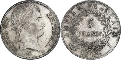 une pièce d'argent sur laquelle figurent le visage d'une femme et des branches de laurier