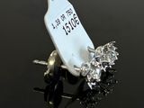a small white tag on a small black object