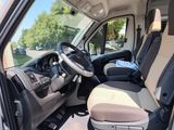 a picture of the inside of a van with the driver ' s seat up