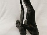 pair of black high heeled shoes on a white background
