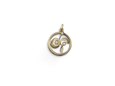 an image of a gold pendant with a flower inside of it