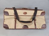 an image of a brown and tan bag with a handle