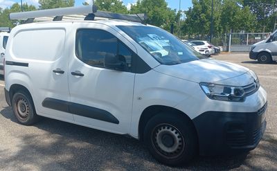 a white van that is parked in a parking lot
