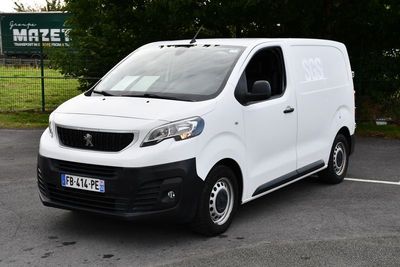 a white van that is parked in a parking lot
