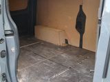 a van with the door open on the side of the road