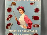 une enseigne en tôle représentant une femme tenant un couteau