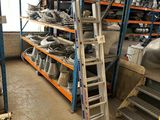 a ladder that is leaning against a wall in a warehouse