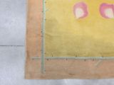 a picture of a piece of art on the floor