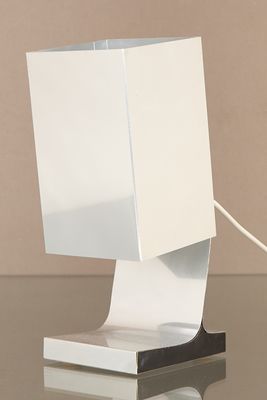 a white lamp that is on top of a table