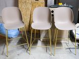 three chairs sitting next to each other in a room