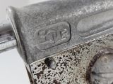 a close up of a metal object on a white surface