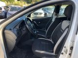 the interior of a car with the door open and the driver ' s seat up