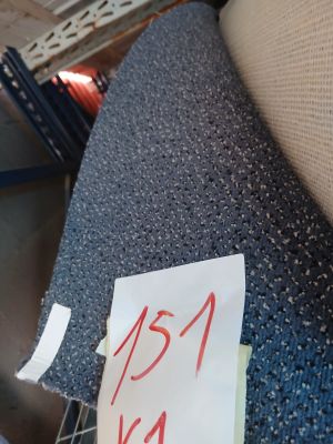 a piece of paper on a chair that has a label on it