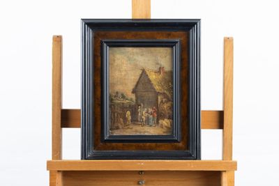 tableau posé sur un chevalet, avec en arrière-plan une peinture représentant une scène de village