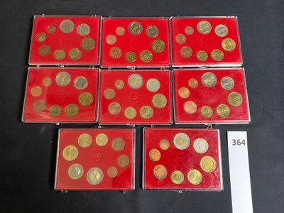 several red and gold coins on a black surface with a price tag
