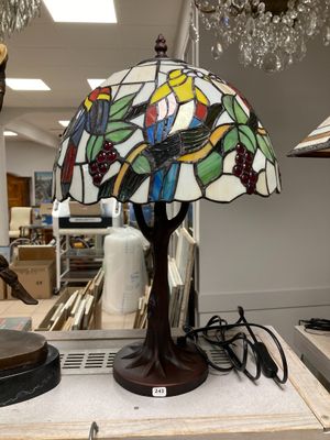 a lamp that is sitting on a table in a room