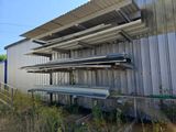 a building that has a bunch of shelves on the side of it