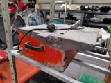 a piece of luggage sitting on top of a metal rack