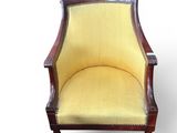 an old chair with yellow upholstered upholstered upholstered upholstered upholstered up