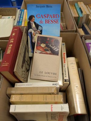 a box full of books that are sitting on the floor