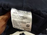 the label on the back of a jacket that says harcoour equestrian