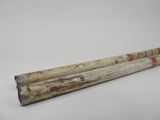 pair of wooden sticks with red and white designs on them on a white surface