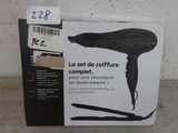a box with a hair dryer on it sitting on the floor