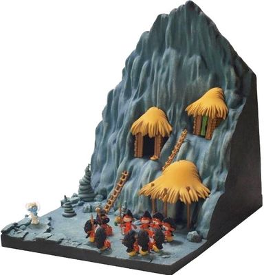 figurines of people in front of a mountain with thatched huts