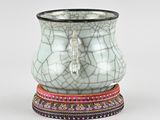 a white vase with a cracky design on it