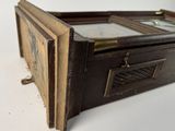 a small wooden box with a mirror on top of it