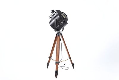 a camera on a tripod on a white background