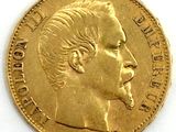 an image of a close up of a gold coin with a man ' s face