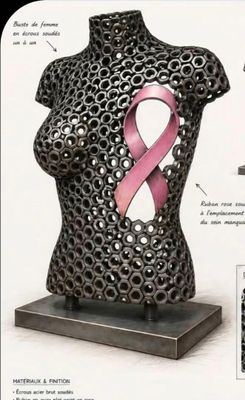 an image of a sculpture of a woman with a pink ribbon on her breast