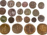 a group of ancient roman coins on a white background
