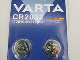 two varta cr2032 batteries on a card with a child safety tag