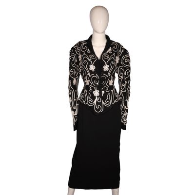 a black and white dress and jacket on a mannequin mannequin mannequin mannequin mannequin mannequin mannequin manne