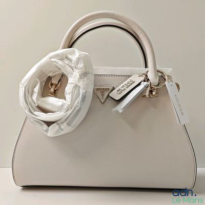 a white purse with a white flower on the handle