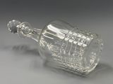 a glass bottle that is sitting on a table