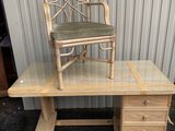 a wooden desk with a chair on top of it