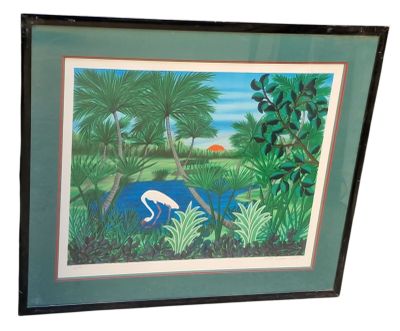 tableau encadré représentant un flamant rose dans un décor tropical
