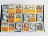 many pokemon cards that are on the table