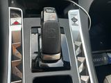 a picture of a car dashboard with a cell phone in the center of it