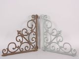 two decorative brackets are shown on a white background