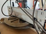 an image of a machine that is working on a piece of wood