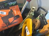 a bucket full of tools and a book on the table