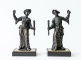 pair of antique bronze figurines of a woman and a man