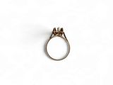 a close up of a ring on a white surface