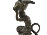 figurine en bronze représentant une femme chevauchant un lion, une coupe sur la tête
