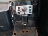 a coffee machine with two cups on top of it